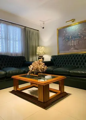 a living room with a couch and a coffee table at HOTEL CASTELAR CORDOBA in Cordoba
