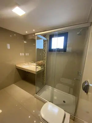 a bathroom with a shower and a toilet and a sink at HOTEL CASTELAR CORDOBA in Cordoba