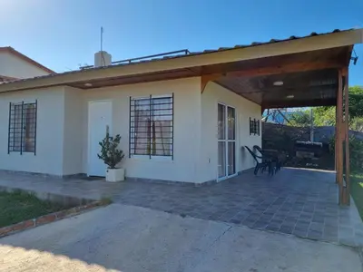 a small house with a large patio at Terrazas de Estancia in Villa Carlos Paz