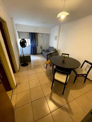 a living room with a table and chairs and a couch at Amplio departamento ZONA CENTRO (2) in Cordoba