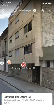 a building with two signs on the side of it at Amplio departamento ZONA CENTRO (2) in Cordoba