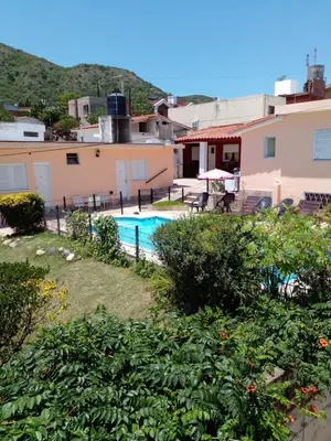 a view of a pool from a house at Amanitas Posada in Villa Carlos Paz