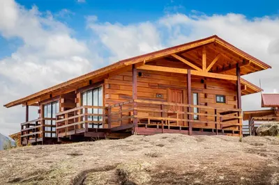 a log cabin on top of a mountain at Alma Serrana - Suites de montaña! in La Cumbrecita