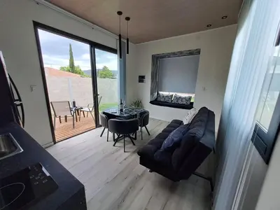 a living room with a couch and a table at Love Sunset in Villa Carlos Paz