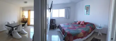 a bedroom with a bed and a table in it at Rosa de los vientos - Cofico in Cordoba