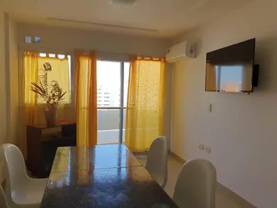 a dining room with a table and chairs and a window at Rosa de los vientos - Cofico in Cordoba
