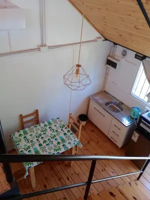 an overhead view of a kitchen in a tiny house at Cabañas Guayacán in Bialet Massé