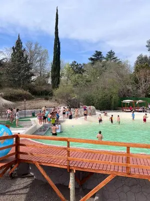 a group of people playing in a swimming pool at Hotel Montana by CPH in Villa Carlos Paz