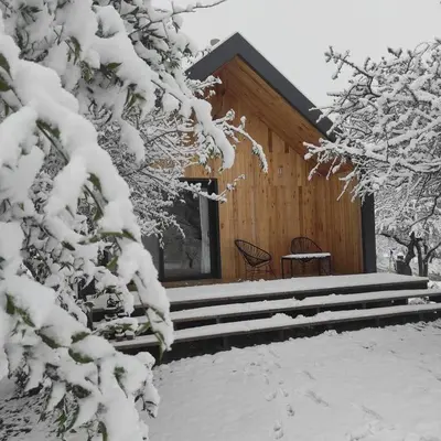 a cabin in the snow with snow covered trees at Finca Granero in Potrero de Garay