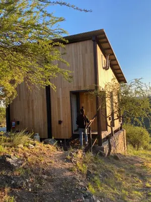 a person standing in front of a building at Finca Granero in Potrero de Garay
