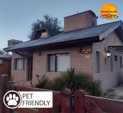 a house with a pet friendly sign in front of it at Atardecer Serrano in Villa General Belgrano