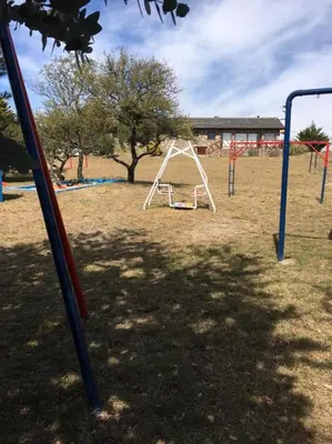 a group of swings in a park at Cabaña julian in La Cumbrecita