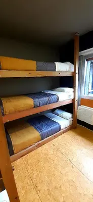 a room with four bunk beds on a shelf at Bucanaan hostel boutique in Cordoba