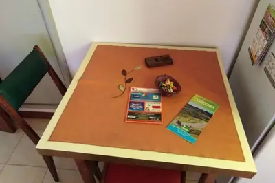 a small wooden table with some books on it at Chalet interno con rooftop in Villa Carlos Paz