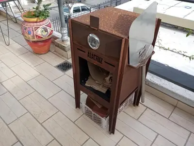a small wooden table with a drawer on a patio at Chalet interno con rooftop in Villa Carlos Paz