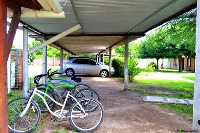 a group of bikes parked under a garage at Hosteria de la Villa ** in Villa Cura Brochero