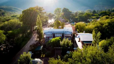an aerial view of a house in a forest at Hostal Las Golondrinas in Bialet Massé
