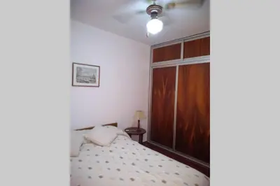 a bedroom with a bed and a large window at DEPARTAMENTO KRISTINA in Villa Carlos Paz