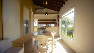 a small kitchen and dining room with a table and chairs at Amardecer - Casa Boutique in Merlo