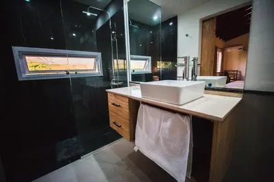 a bathroom with a sink and a shower at Amardecer - Casa Boutique in Merlo