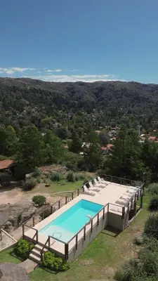 an overhead view of a swimming pool on a hill at Balcones de La Cumbrecita in La Cumbrecita