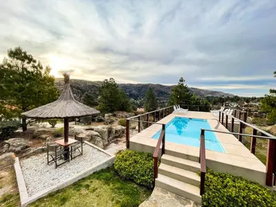 an image of a swimming pool in a house at Balcones de La Cumbrecita in La Cumbrecita
