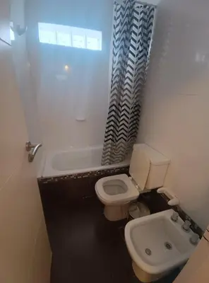 a small bathroom with a toilet and a sink at Excelente SEMIPISO vista al Buen Pastor in Cordoba