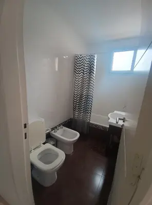 a bathroom with two toilets and a sink at Excelente SEMIPISO vista al Buen Pastor in Cordoba