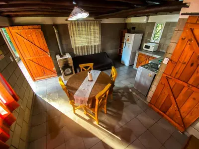 an overhead view of a kitchen and a table and chairs at Cabañas El Nogal in Villa Anizacate