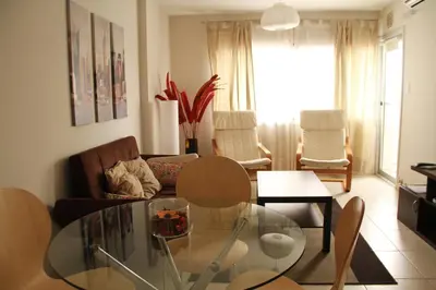 a living room with a glass table and a couch at Cordoba Rent Centro Avellaneda in Cordoba