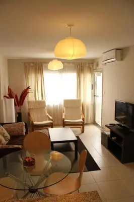 a living room with a glass table and chairs at Cordoba Rent Centro Avellaneda in Cordoba