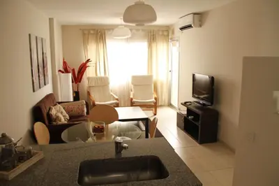 a kitchen and living room with a sink and a living room at Cordoba Rent Centro Avellaneda in Cordoba