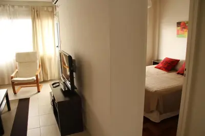 a bedroom with a bed and a tv in a room at Cordoba Rent Centro Avellaneda in Cordoba
