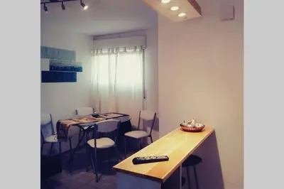 a room with a table with a remote control on it at Nuevocentro Modern in Cordoba