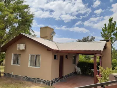 a small house with a roof at Cabañas Ecos del Valle in Los Reartes