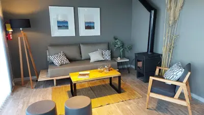 a living room with a couch and a table at LUNALBA in Potrero de Garay