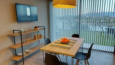 a dining room table with a bowl of oranges on it at LUNALBA in Potrero de Garay