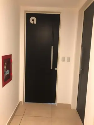 a black door with a handle in a room at Departamento 2 dormitorios Nueva Cordoba in Cordoba