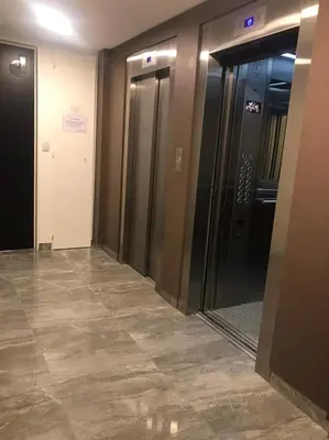 an elevator lobby with two elevators in a building at Departamento 2 dormitorios Nueva Cordoba in Cordoba