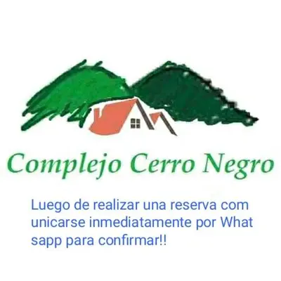 a picture of a christmas tree with a house at Departamento Cerro Negro in Villa General Belgrano