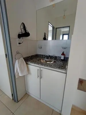 a bathroom with a sink and a mirror at Alto Tucumán in Cordoba