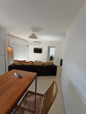a living room with a couch and a table at Alto Tucumán in Cordoba