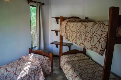 two bunk beds in a room with a window at La Morada in Merlo