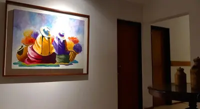a painting of a group of people on a wall at Lion D`Or in Villa Carlos Paz