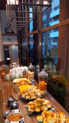 a table with many plates of food on it at Lion D`Or in Villa Carlos Paz