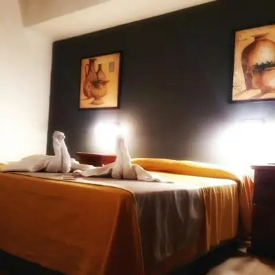 two stuffed animals sitting on top of a bed at Lion D`Or in Villa Carlos Paz