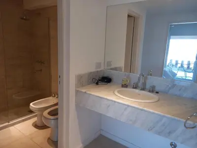 a bathroom with a sink and a toilet at Apart Carlos Paz Golf Country Club in Villa Carlos Paz