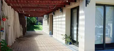 an empty walkway outside of a building with awning at Lago Azul in Embalse