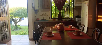 a kitchen with a table with two cups on it at Lago Azul in Embalse
