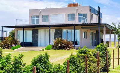 a house on a hill with a fence at Puerto del Aguila potrero de Garay Inbalo 01 in Los Reartes